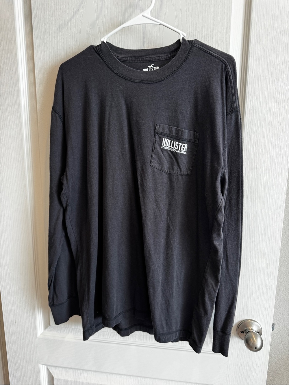 Hollister Black Long Sleeve Pocket Tee with White Chest Logo